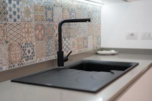 Kuchyňa alebo kuchynka v ubytovaní Gramsci Luxury apartment By Dimorra