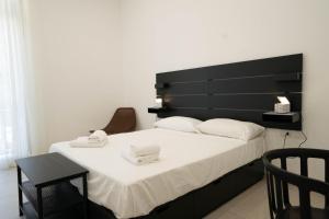 Posteľ alebo postele v izbe v ubytovaní Gramsci Luxury apartment By Dimorra