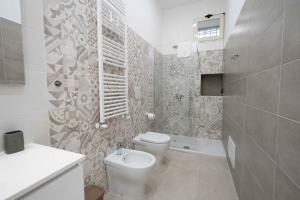 Kúpeľňa v ubytovaní Gramsci Luxury apartment By Dimorra