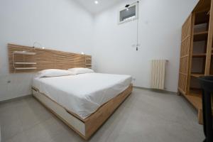 Posteľ alebo postele v izbe v ubytovaní Gramsci Luxury apartment By Dimorra