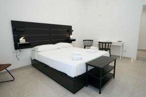 Posteľ alebo postele v izbe v ubytovaní Gramsci Luxury apartment By Dimorra
