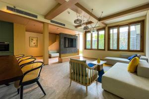a living room with a couch and a table at voco Nanjing Garden Expo by IHG in Nanjing