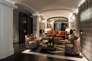 a living room with two chairs and a couch at Eight Hotel Portofino in Portofino