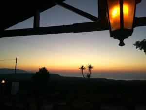a view of a sunset from a house at House of Polymnia in Sissi