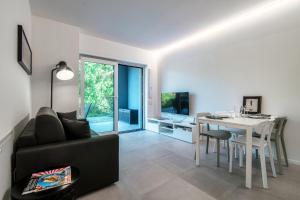 A television and/or entertainment centre at My Venini - by MyHomeInComo