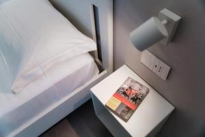 A bed or beds in a room at My Venini - by MyHomeInComo