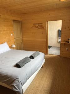 a bedroom with a large bed and a bathroom at Luxury Guest House in the Centre of Argeles Gazost in Argelès-Gazost