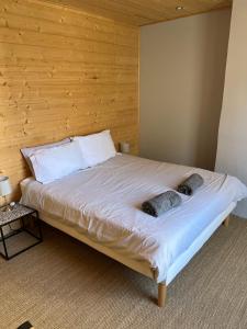 a bedroom with a bed with two dogs laying on it at Luxury Guest House in the Centre of Argeles Gazost in Argelès-Gazost