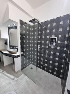 a bathroom with a shower and a sink at Casa viotti Le fuoriserie in Palermo
