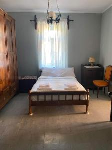 Postel nebo postele na pokoji v ubytování Ioanna's House