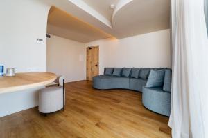 a living room with a couch and a table at Pacha Hotel in Ibiza Town