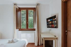 Postel nebo postele na pokoji v ubytování Vallicciola Nature Hotel