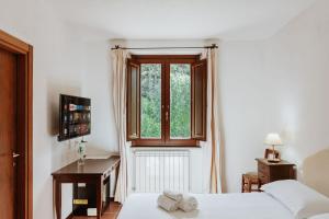 Postel nebo postele na pokoji v ubytování Vallicciola Nature Hotel