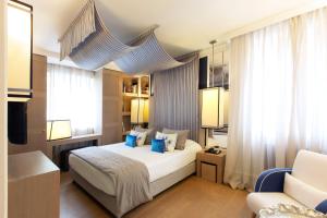 Voodi või voodid majutusasutuse Eight Hotel Paraggi toas