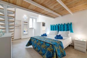 A bed or beds in a room at Angolo del Sole