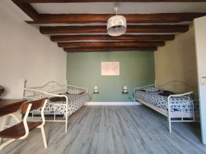 Llit o llits en una habitació de Les capucines ,proche Beauval & châteaux de la Loire