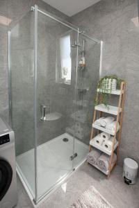 a shower with a glass door in a bathroom at Luxury apartment Eva in Zadar +24 photos