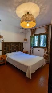 Säng eller sängar i ett rum på Hotel de Montaña La Hortizuela