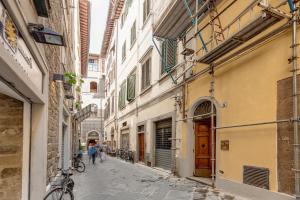a street in an old town with buildings at Lezioso, Apartments in Florence in Florence