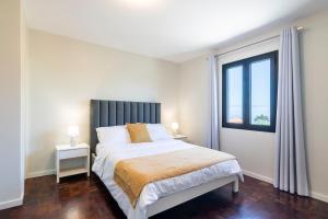 Ένα ή περισσότερα κρεβάτια σε δωμάτιο στο Villa Pearl