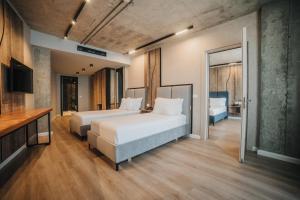 Postel nebo postele na pokoji v ubytování AMR Hotel - Durres