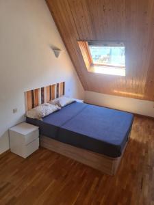 a bedroom with a bed with a wooden ceiling at Apartamento en Panticosa in Panticosa