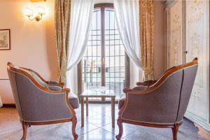 Posedenie v ubytovaní Molino Stucky Residence Burchio Suite