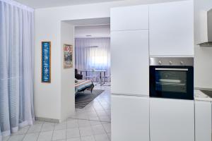 Kuchyň nebo kuchyňský kout v ubytování NOVIGRAD BOUTIQUE APARTMENT