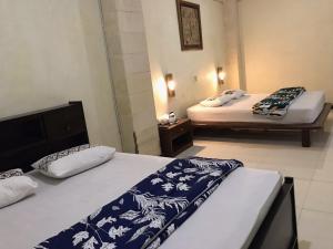 Кровать или кровати в номере Lotus 2 Guest House