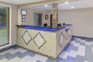 a lobby with a reception desk in a house at Super 8 by Wyndham Okawville in Okawville