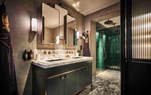 a bathroom with a sink and a shower at Chateau Denmark in London