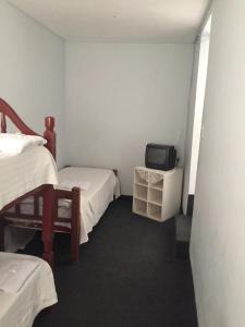 Una cama o camas en una habitación de Aparthotel Continental