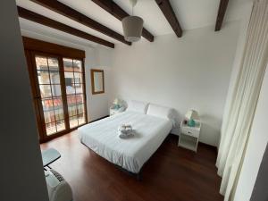 En eller flere senge i et værelse på Casa La Llosa en Suances