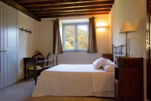 מיטה או מיטות בחדר ב-Agriturismo I Giunchi