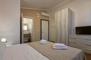 Posteľ alebo postele v izbe v ubytovaní Vico Rooms
