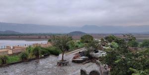 a view of a river from a building at Prime Neelkanth Forest Retreat Resort in Tehla