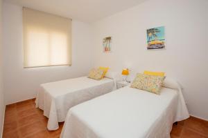 A bed or beds in a room at Cristina III