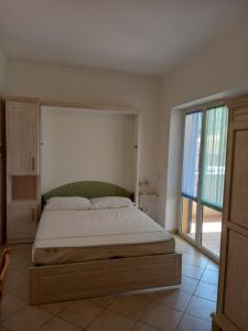 Postel nebo postele na pokoji v ubytování Il Roseto