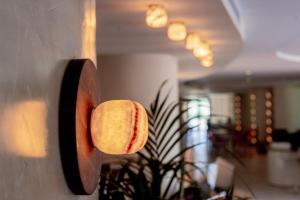 a baseball is hanging on a wall at Pacha Hotel in Ibiza Town