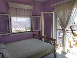 Postel nebo postele na pokoji v ubytování Villa Mitselo Apartments