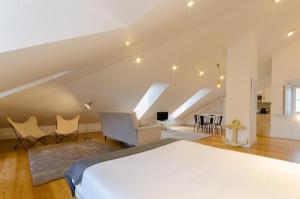 En eller flere senge i et værelse på Light House Apartments - Casas da Baixa