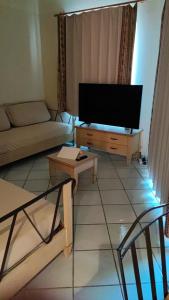 TV a/nebo společenská místnost v ubytování La tua vacanza mare e relax - Sardegna- 2 o 4 pax