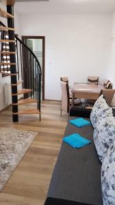 a living room with a couch and a table at ADAM-OASIS in Borzont +29 photos
