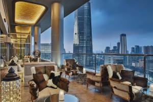 a hotel lobby with a view of a city at Four Seasons Hotel Jakarta in Jakarta