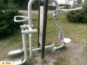 a group of exercise equipment in the grass at Apartamenty Pod Lipami in Junoszyno