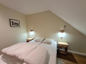 Posteľ alebo postele v izbe v ubytovaní Le Faubourg - Gîte et chambres d'hôte