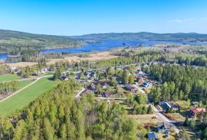 an aerial view of a resort with a lake at Buskbacken Logi in Bollnäs