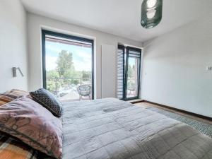 Posteľ alebo postele v izbe v ubytovaní Apartament VIP CENTRUM