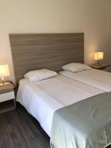 Llit o llits en una habitació de Be Lisbon Residence Marquês