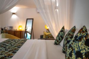 Postel nebo postele na pokoji v ubytování White Paradise Zanzibar